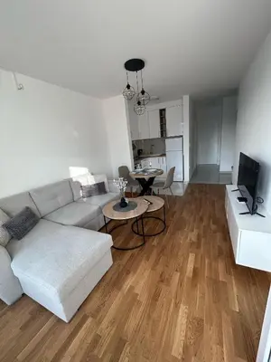 a living room with a couch and a table at Apartmani Kastel 1 in Banja Luka