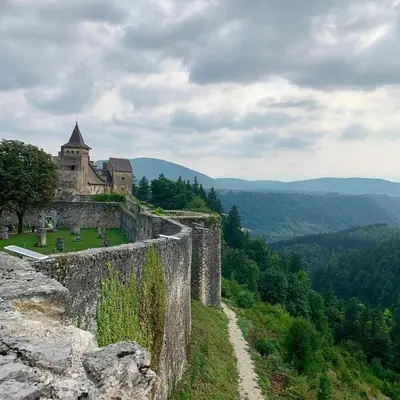a castle on top of a hill with a dirt road at Lilium in Cazin