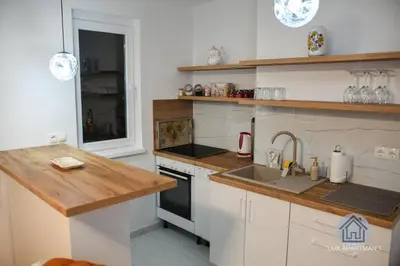 a kitchen with a sink and a counter top at Lux Apartment 1 - Zenica in Zenica