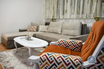a living room with a couch and a table at Lux Apartment 1 - Zenica in Zenica