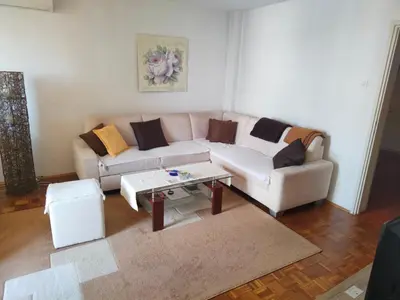 a living room with a couch and a coffee table at Apartman Stella in Banja Luka
