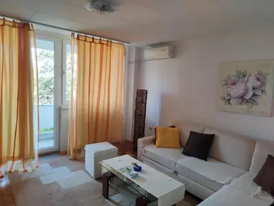a living room with a couch and a table at Apartman Stella in Banja Luka