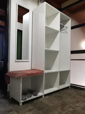 a white closet with a stool and a mirror at Evergreen in Banja Luka