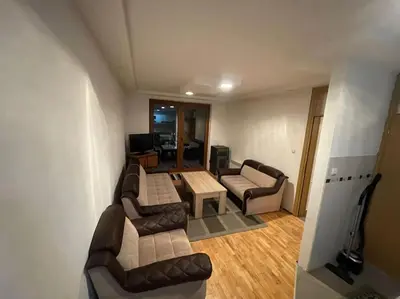 a living room with two couches and a table at Apartment Vlasic in Šišava