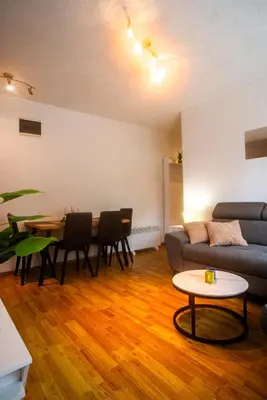 a living room with a couch and a table at Apartman Gnječ Kupres in Kupres