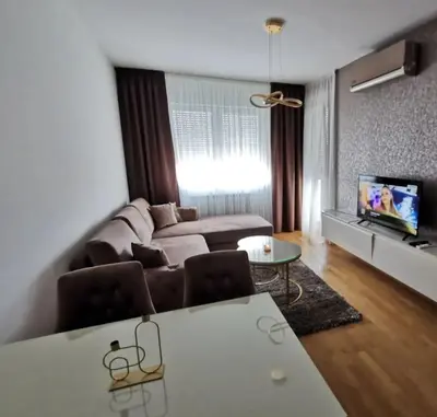 a living room with a couch and a table at Alex LUX Banjaluka in Železnička Stanica Incel