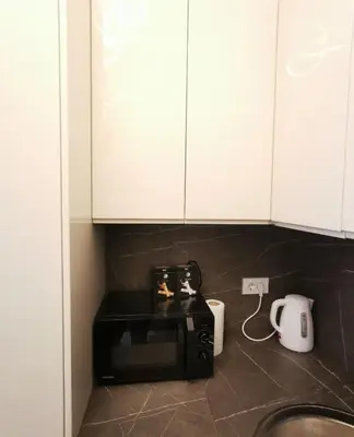 a kitchen counter with a microwave and a coffee maker at Alex LUX Banjaluka in Železnička Stanica Incel