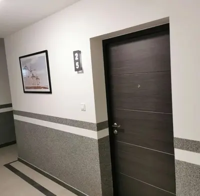 a door in a room with stripes on the wall at Alex LUX Banjaluka in Železnička Stanica Incel