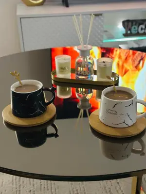 two cups of coffee sitting on top of a table at Apartman-Amko in Tuzla