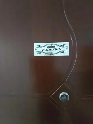 a sign on the ceiling of a bathroom at Apartman SANDRA in Modriča