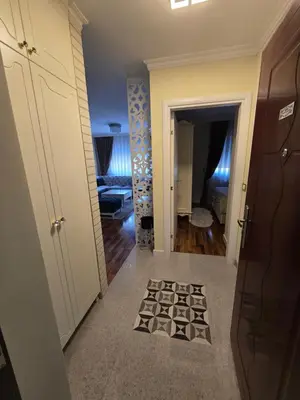 a hallway with a door leading into a room at Apartman SANDRA in Modriča