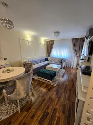 a living room with a couch and a table at Apartman SANDRA in Modriča