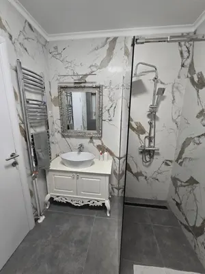 a bathroom with a sink and a mirror at Apartman SANDRA in Modriča