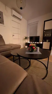 a living room with a table and a couch at Apartman MARIA Livno in Livno