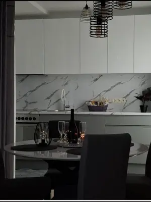 a kitchen with a table with wine glasses on it at Apartman MARIA Livno in Livno