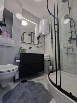 a bathroom with a shower and a toilet and a sink at Apartman MARIA Livno in Livno