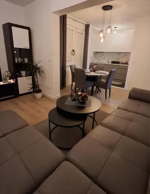 a living room with a couch and a table at Apartman MARIA Livno in Livno