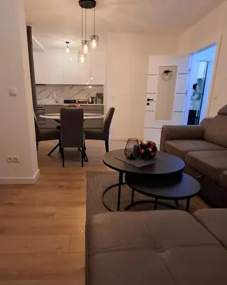 a living room with a couch and a table at Apartman MARIA Livno in Livno