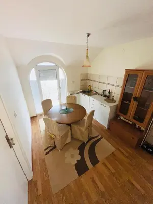 a kitchen and dining room with a table and chairs at La Simba in Banja Luka