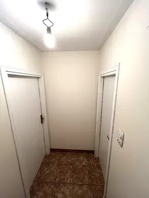 an empty room with two doors and a tile floor at La Simba in Banja Luka
