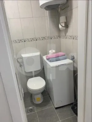 a small bathroom with a toilet and a sink at Apartman 078 in Banja Luka