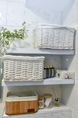 a white wicker basket on a shelf in a kitchen at Apartman LILI centar in Banja Luka