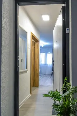 a hallway with a door leading into a room at Apartman LILI centar in Banja Luka
