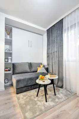 a living room with a couch and a table at Apartman LILI centar in Banja Luka
