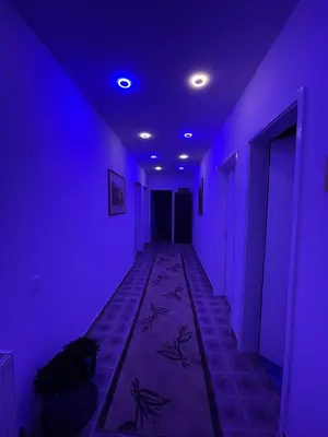 a purple room with a hallway with purple lights at Apartmani Sweet Dreams in Banja Luka
