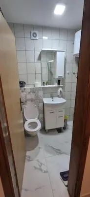 a bathroom with a toilet and a sink at Viktory in Vlasic