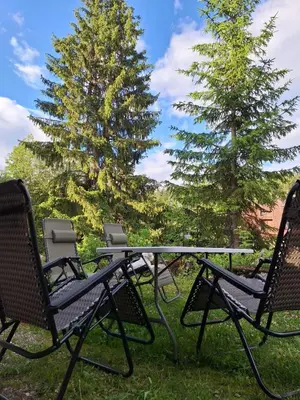 two chairs and a table and two trees at Viktory in Vlasic