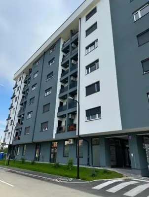 a large apartment building on the side of a street at Apartment Shine - Borik in Banja Luka
