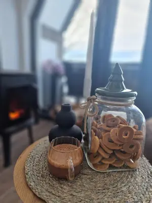 a glass jar filled with cookies on top of a table at Lukina koliba-vikendica-Manjaca in Banja Luka