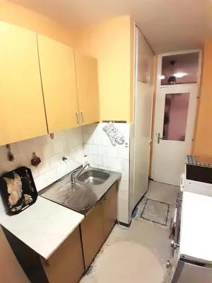 a small kitchen with a sink and a refrigerator at La Simba2 in Banja Luka