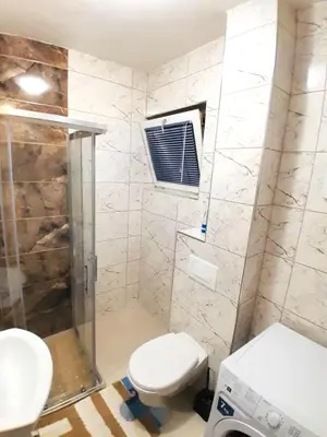 a bathroom with a toilet and a shower at La Simba2 in Banja Luka