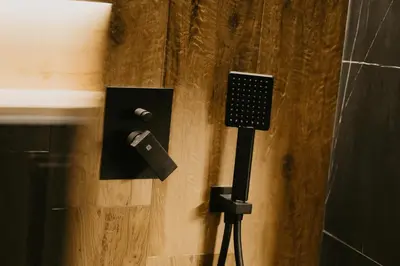 a black object on a wall next to a door at Zapato Apartment Tuzla in Tuzla