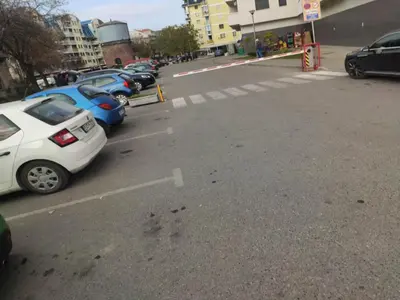 a row of cars parked in a parking lot at Apartman Luka in Doboj