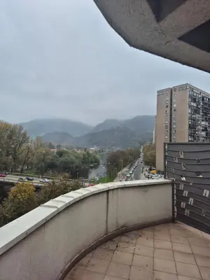 a view of a city from a balcony of a building at Apartmans Zenica in Zenica