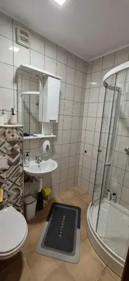 a bathroom with a shower and a sink at Viktory II in Vlasic