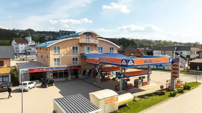 an overhead view of a gas station in a town at Motel Jelić in Kraševo