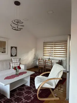 a living room with a couch and a table at Visoko City Apartment in Visoko