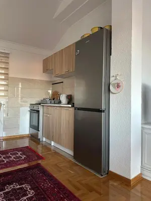 a kitchen with a stainless steel refrigerator at Visoko City Apartment in Visoko