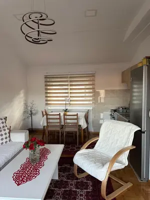 a living room with a couch and a table at Visoko City Apartment in Visoko