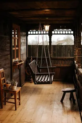 a porch with a swing in a room at Koliba Brezova šuma in Čović Polje