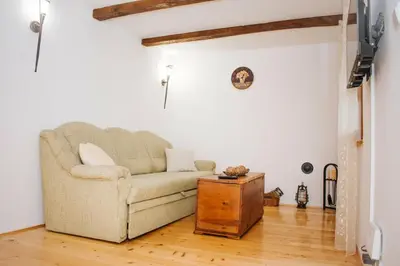 a living room with a couch and a table at Koliba Brezova šuma in Čović Polje
