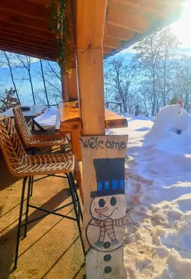 a snowman sign on the side of a house at Kuca za odmor in Vitez
