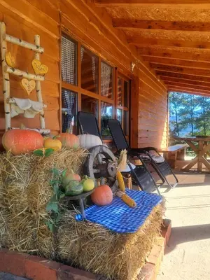 a pile of hay on the front of a cabin at Kuca za odmor in Vitez