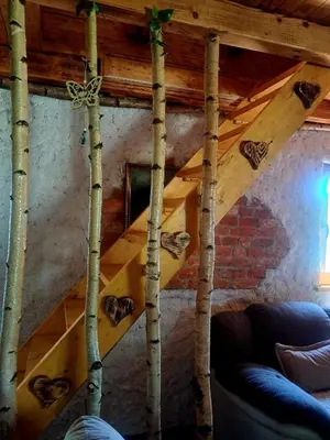 a room with a wooden attic with trees in it at Kuca za odmor in Vitez
