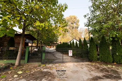 a black fence with a no parking sign on it at Heaven Heart - Apartmani Tuzla in Tuzla