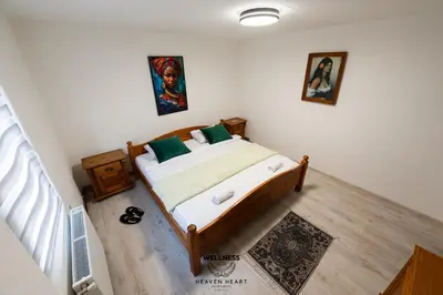 a bedroom with a bed in a room at Heaven Heart - Apartmani Tuzla in Tuzla